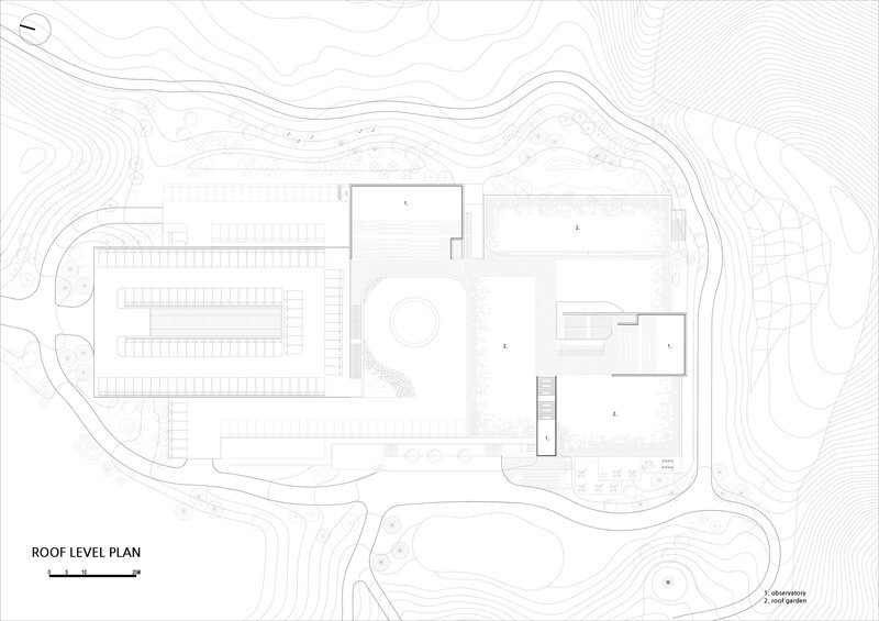 Roof level plan drawing showing clustered volumes with a central circular element set into undulating topography