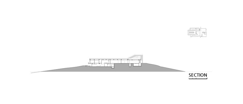 Section drawing showing the building's linear layout following the hillside gradient