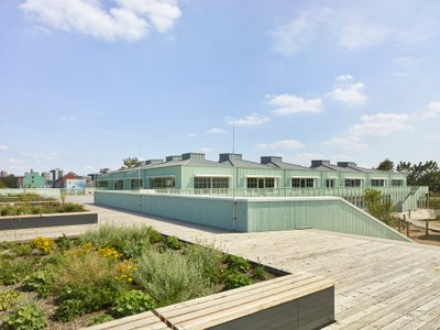 LRO Builds a Timber Village of Hipped-Roof Classrooms on a Former US Military Base in Mannheim