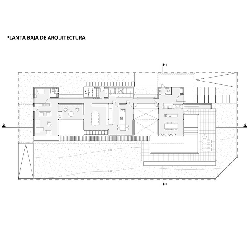 Ground floor plan drawing showing living spaces, courtyards, and a central staircase