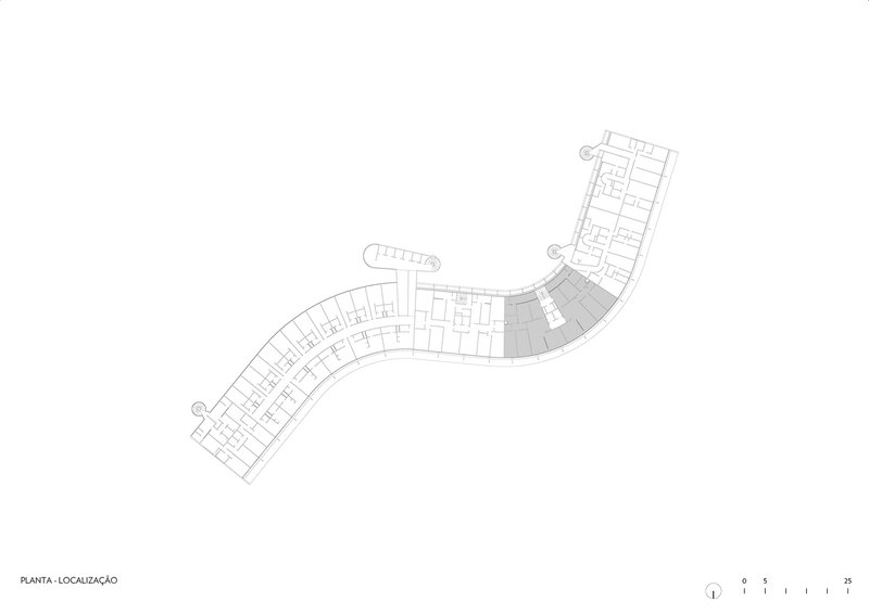 Site plan drawing showing a curved bar building with repeated cellular units along its length
