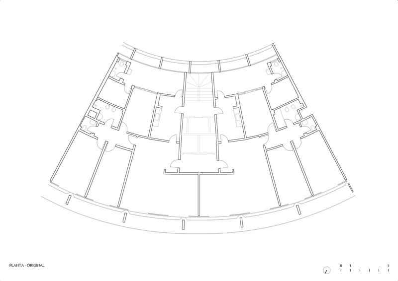 Floor plan drawing of a curved building with central core and symmetrical wing arrangement