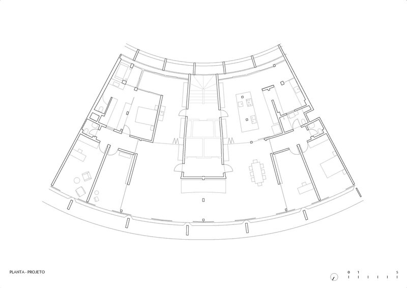 Floor plan drawing showing residential units with furnishings around a central elevator and stair core