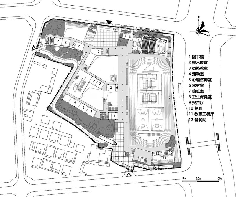 Site plan with contoured landscape areas, sports courts, and classrooms arranged around a central athletic field