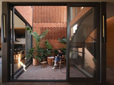 Estudio Mero Builds a Terracotta House Around a Central Patio in Querétaro's White Suburbs