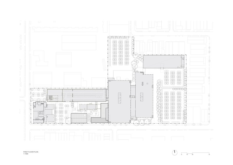 First floor plan drawing showing two large open volumes connected by circulation zones