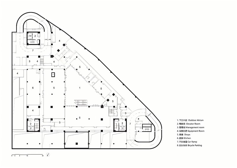 Floor plan drawing showing a triangular podium level with shops and parking circulation