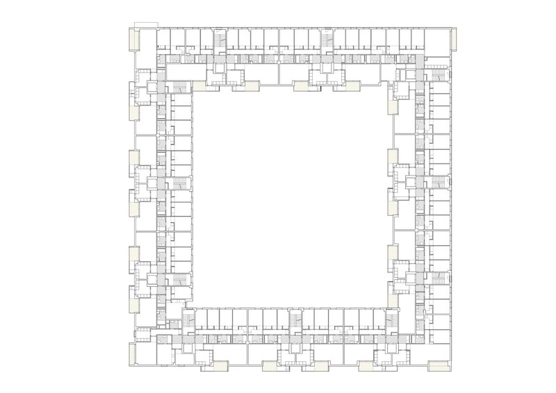 Floor plan drawing showing residential units arranged around a large open central courtyard space