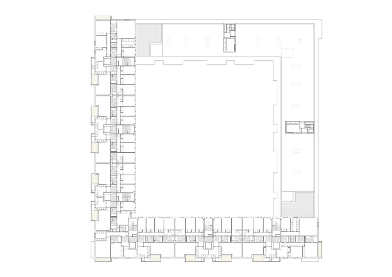 Floor plan drawing showing residential units along three sides and a large open hall at top