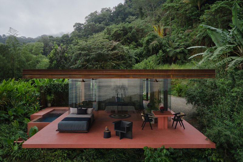 Elevated red terrace with glass-walled pavilion under a timber soffit surrounded by dense jungle vegetation
