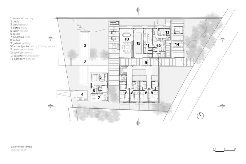 Ground floor plan drawing showing living spaces, courtyard, and terrace arranged around an angled site