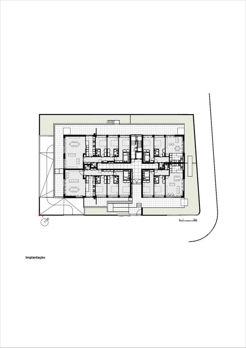 Ground floor plan drawing showing residential units arranged around central circulation and stair core