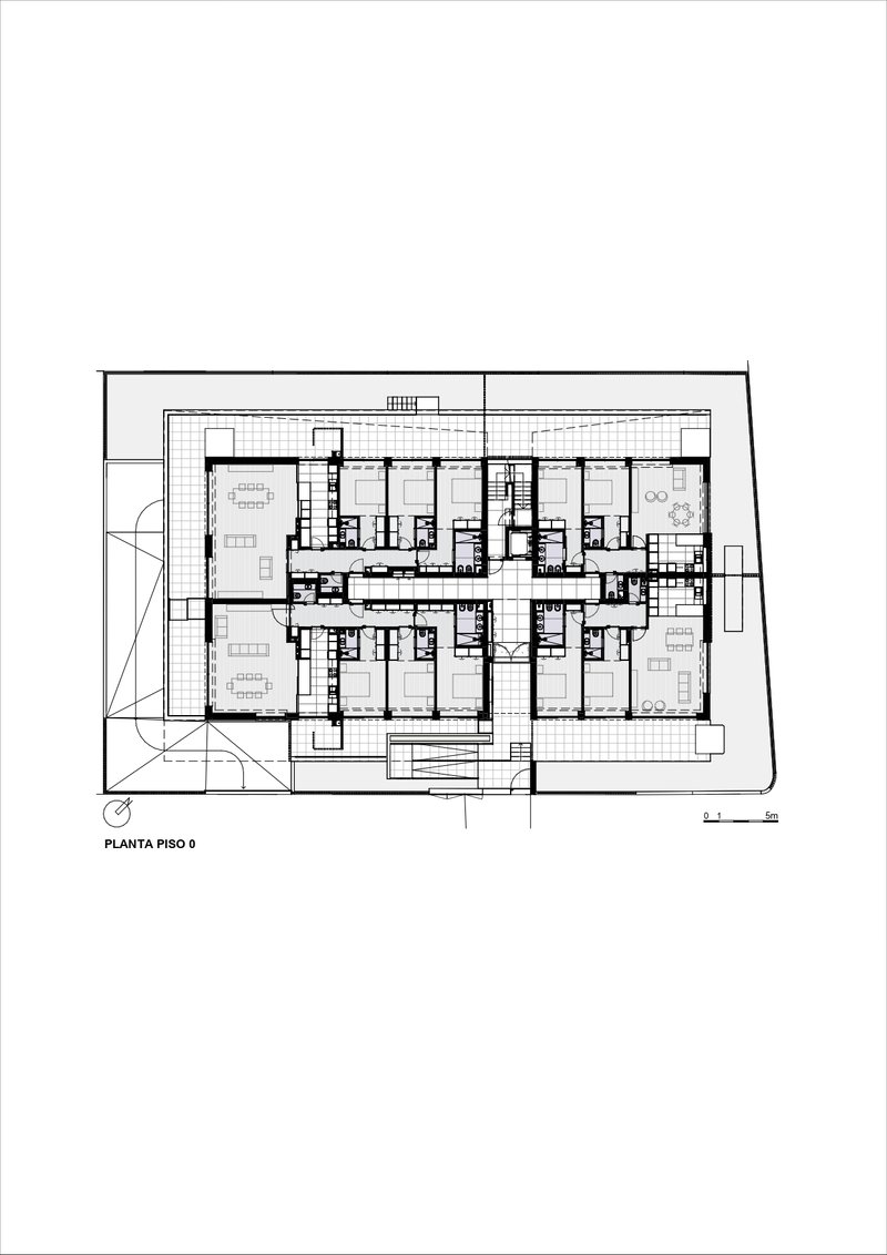 Floor plan drawing showing residential units arranged around a central core with terraces at corners