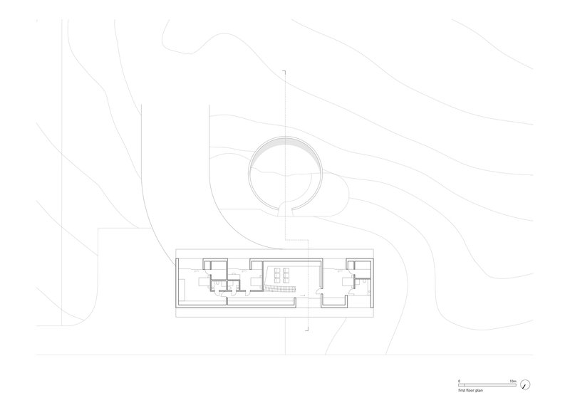 First floor plan drawing revealing a circular upper level connected to a linear wing