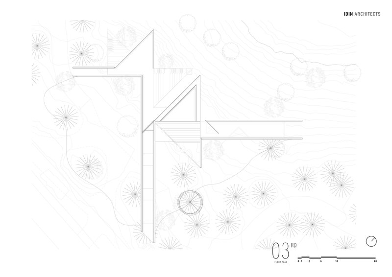 Floor plan drawing depicting volumes with angular roofs and landscaping elements in plan view