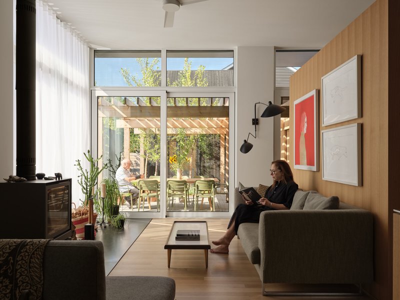 Living area looking toward the glass doors opening onto the timber pergola and courtyard