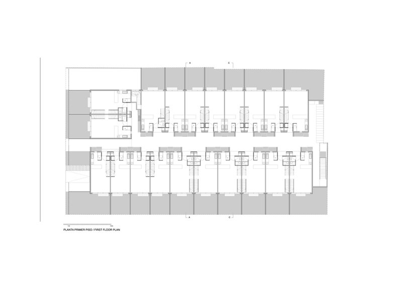 First floor plan drawing showing residential units arranged along a linear bar with central staircases