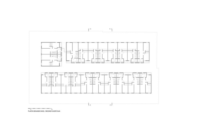 Second floor plan drawing showing repeated residential units flanking a central corridor and stair cores