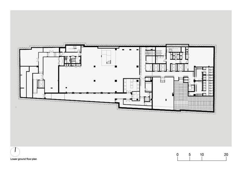Lower ground floor plan drawing revealing two large volumes separated by circulation and support spaces