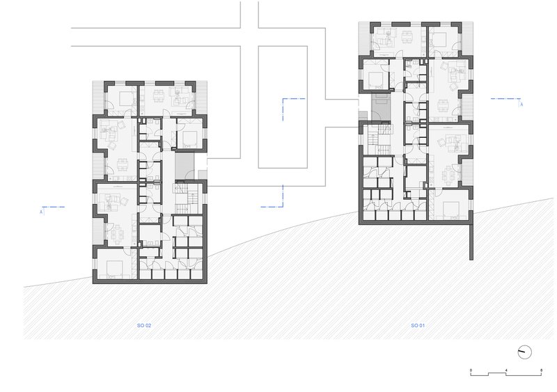 Floor plan drawing showing two multi-unit residential buildings with room layouts and circulation cores