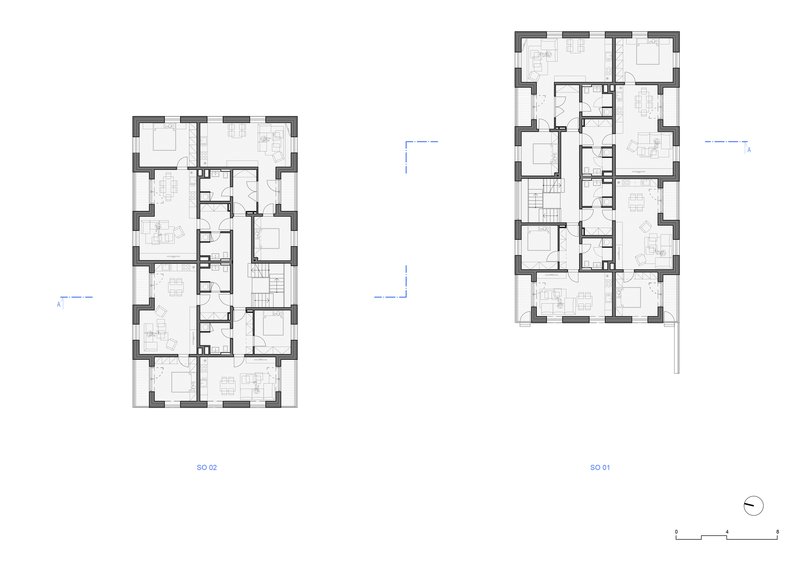 Floor plan drawing showing two residential buildings with rectangular layouts and central stairwells