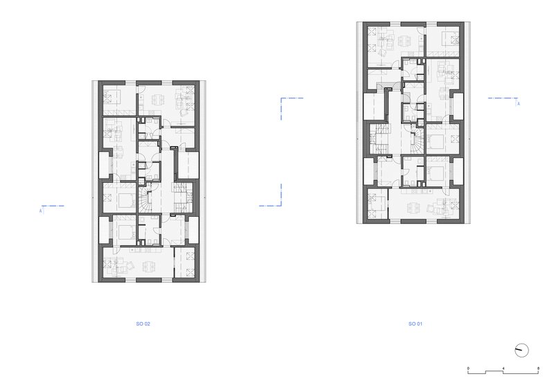 Floor plan drawing showing two multi-unit residential buildings with thick perimeter walls and shared circulation cores
