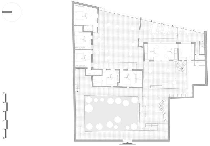 Floor plan drawing showing rooms arranged around a central pool with perimeter courtyard spaces