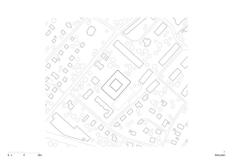 Site plan drawing showing the building footprint surrounded by existing trees and adjacent street patterns