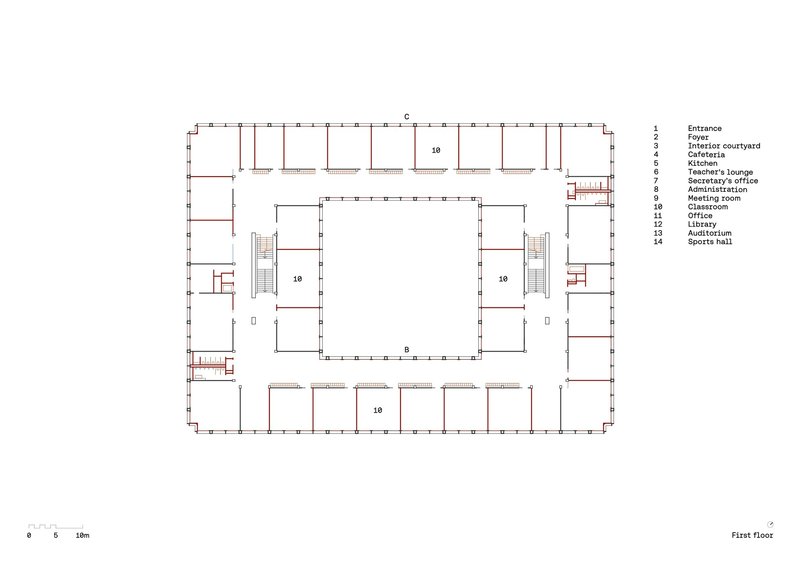 First floor plan drawing showing classrooms arranged around a central void with staircases at opposite corners