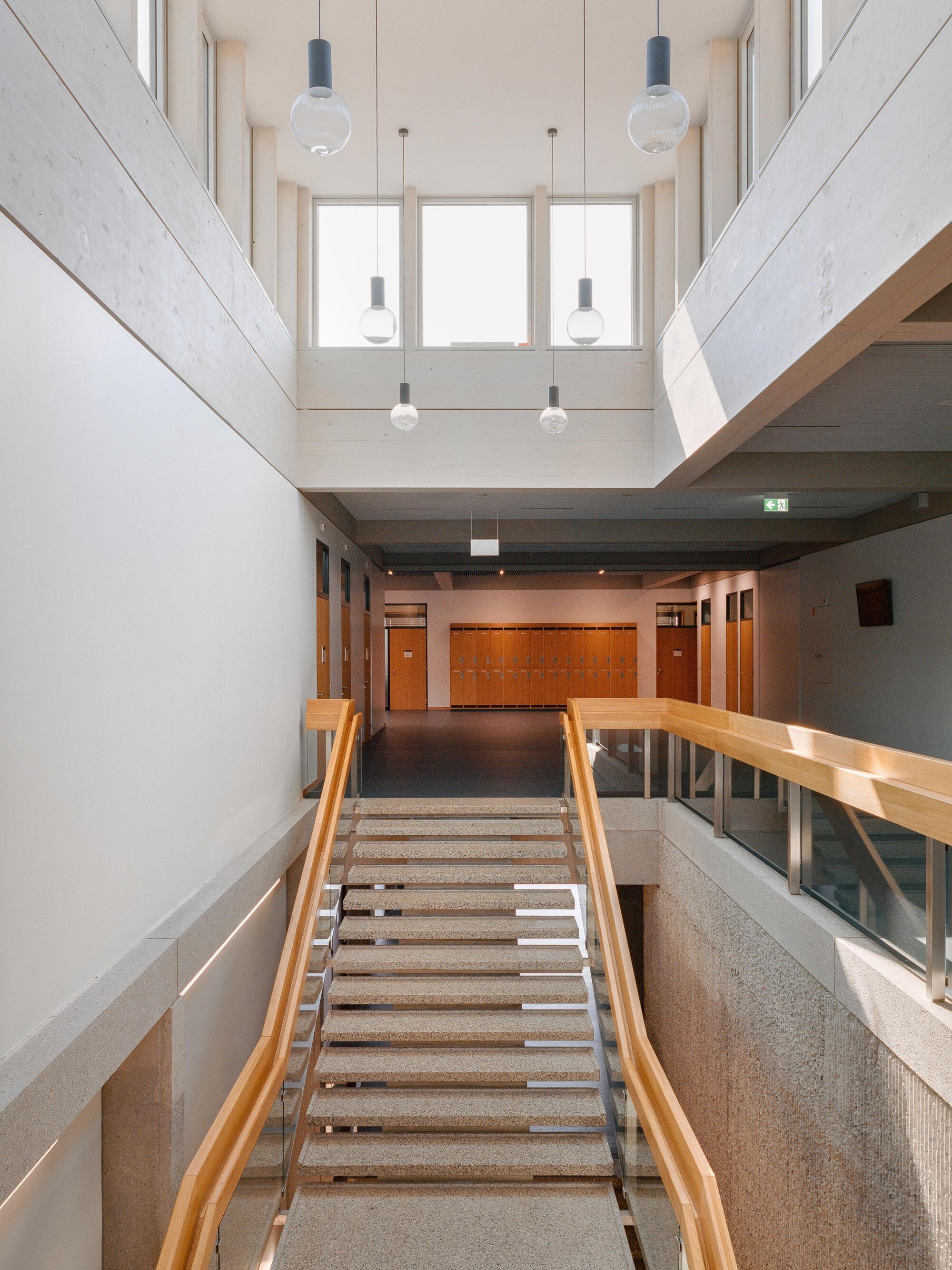 Burckhardt Lifts a Timber Story onto a 1969 Brutalist School in Geneva Without Breaking the Spell