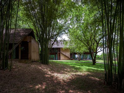 PAVA Architects Rebuilds an Abandoned Rice Mill into a Mekong Riverfront House in Thailand