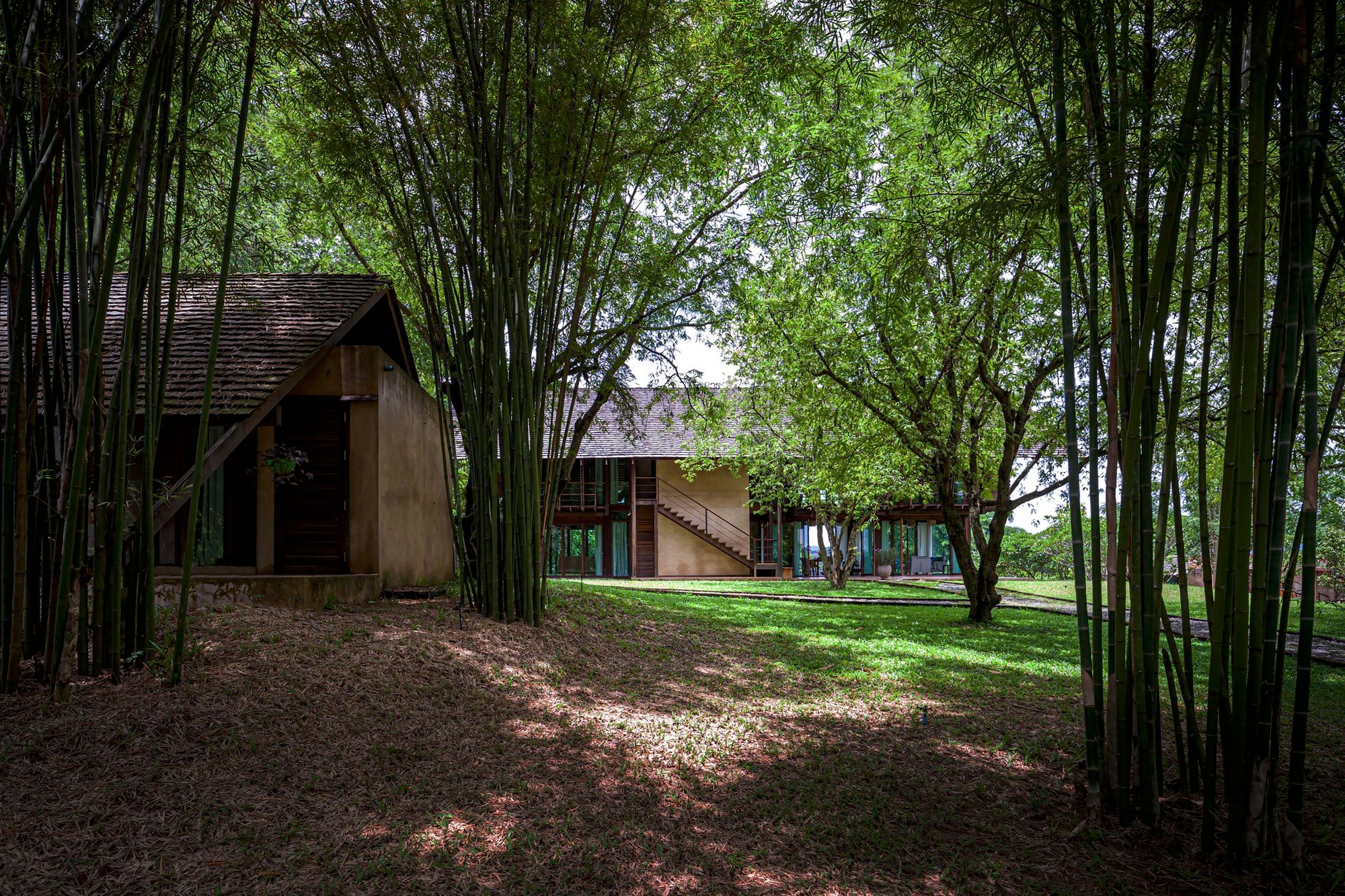 PAVA Architects Rebuilds an Abandoned Rice Mill into a Mekong Riverfront House in Thailand