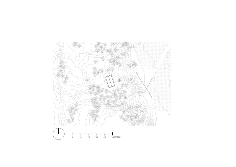 Site plan drawing showing a rectangular volume nestled among contoured hillside topography and scattered tree clusters