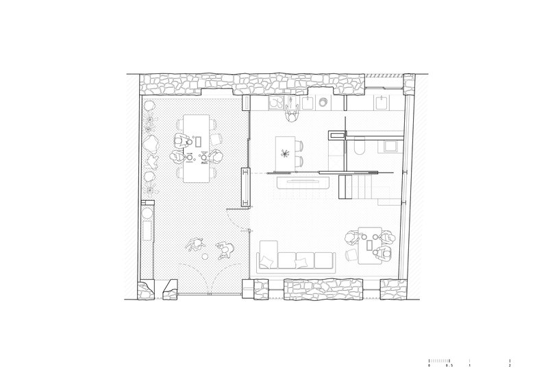 Ground floor plan drawing showing interior layout with courtyard and rooms within stone perimeter walls