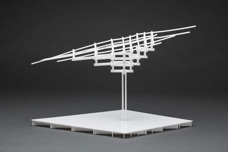 Physical model of a tilted gridded roof canopy supported by twin columns on a flat platform base