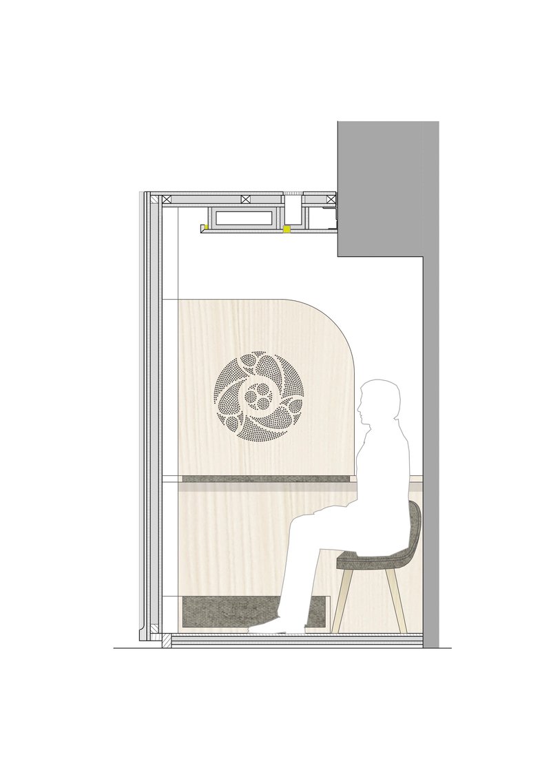 Section drawing showing seated figure inside confessional chamber with decorative motif and overhead lighting detail