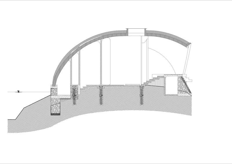 Section drawing showing the curved roof shell with suspended columns and foundation details below grade