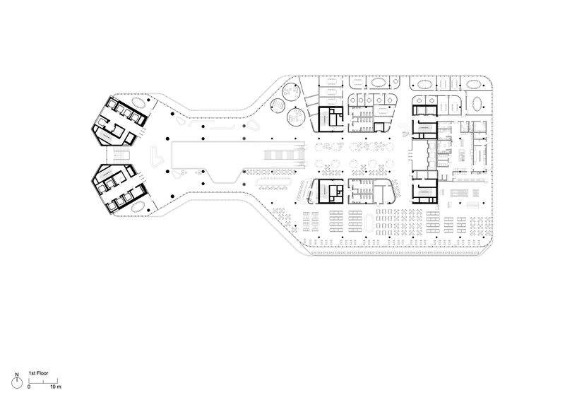 First floor plan drawing showing the irregular footprint connecting two pentagonal volumes with a retail podium