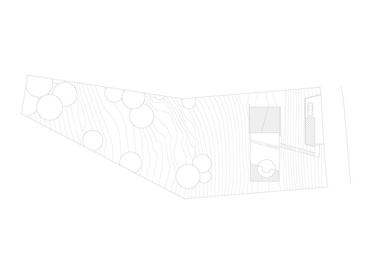 Site plan drawing showing a sloped landscape with circular tree canopies and two rectilinear volumes