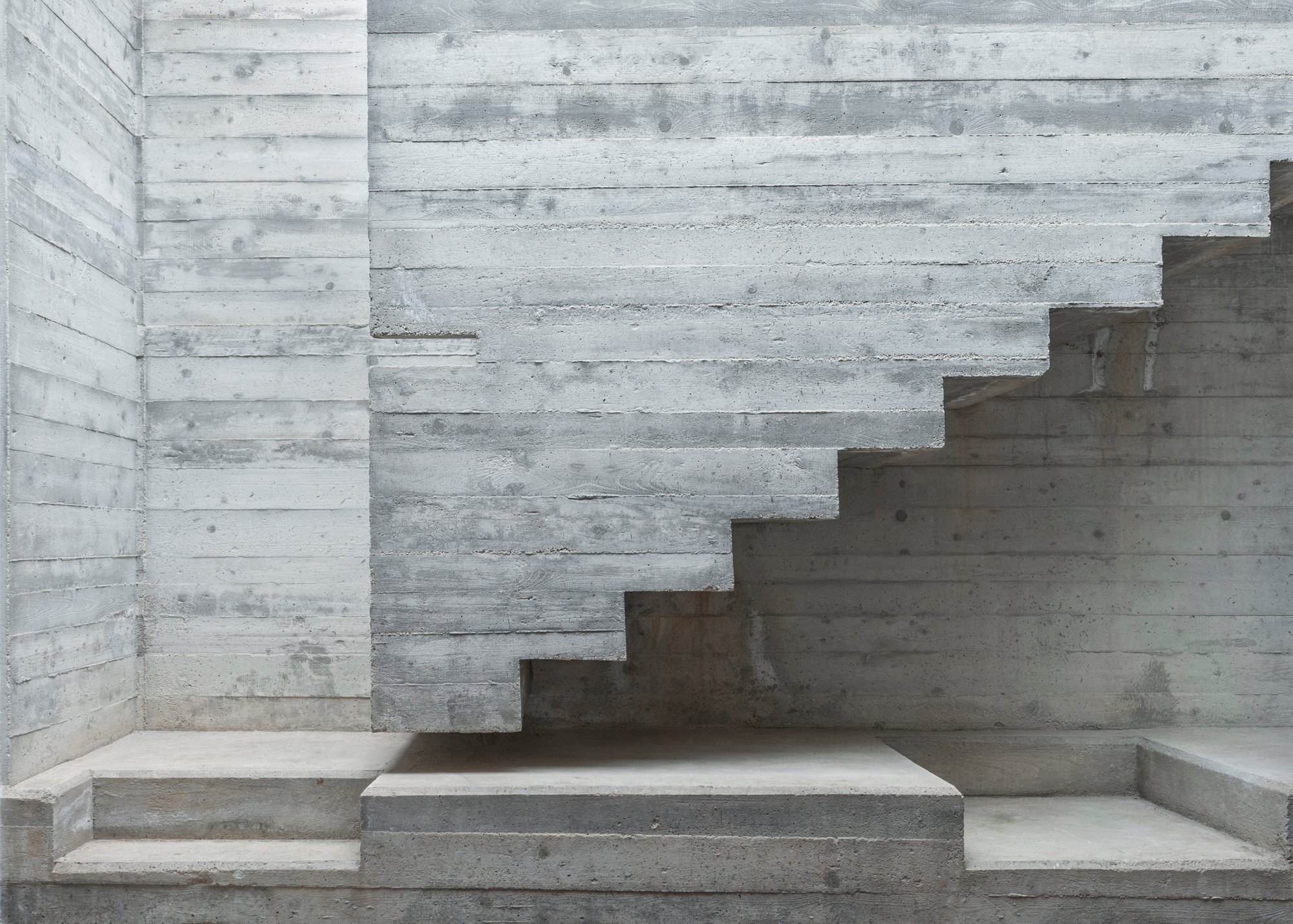 MODEL Carves a Scarpa-Inspired Concrete Core Through a Maltese Period House for Two Sisters