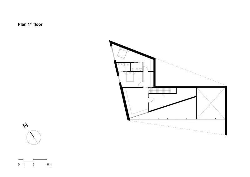 First floor plan drawing showing an angular wedge-shaped volume with small rooms at one end and an open space
