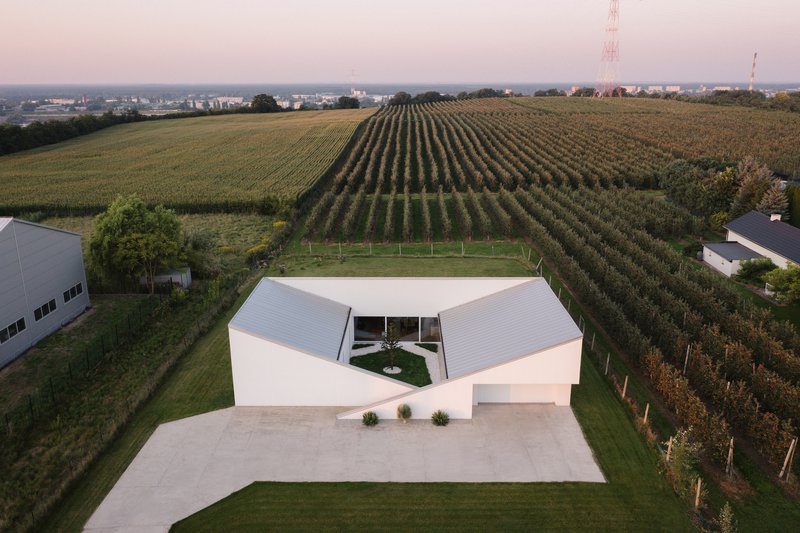 SOURCE Architecture Studio Turns a Polish Planning Rule into a Walkable Roof Hill