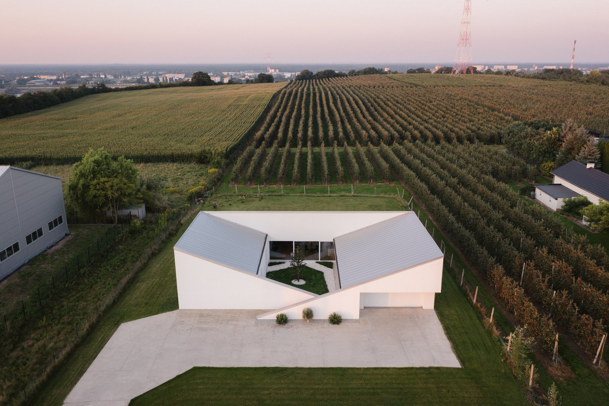 SOURCE Architecture Studio Turns a Polish Planning Rule into a Walkable Roof Hill