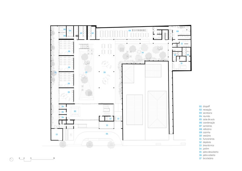 Ground floor plan drawing showing classrooms along the perimeter and two sports courts in the central volume