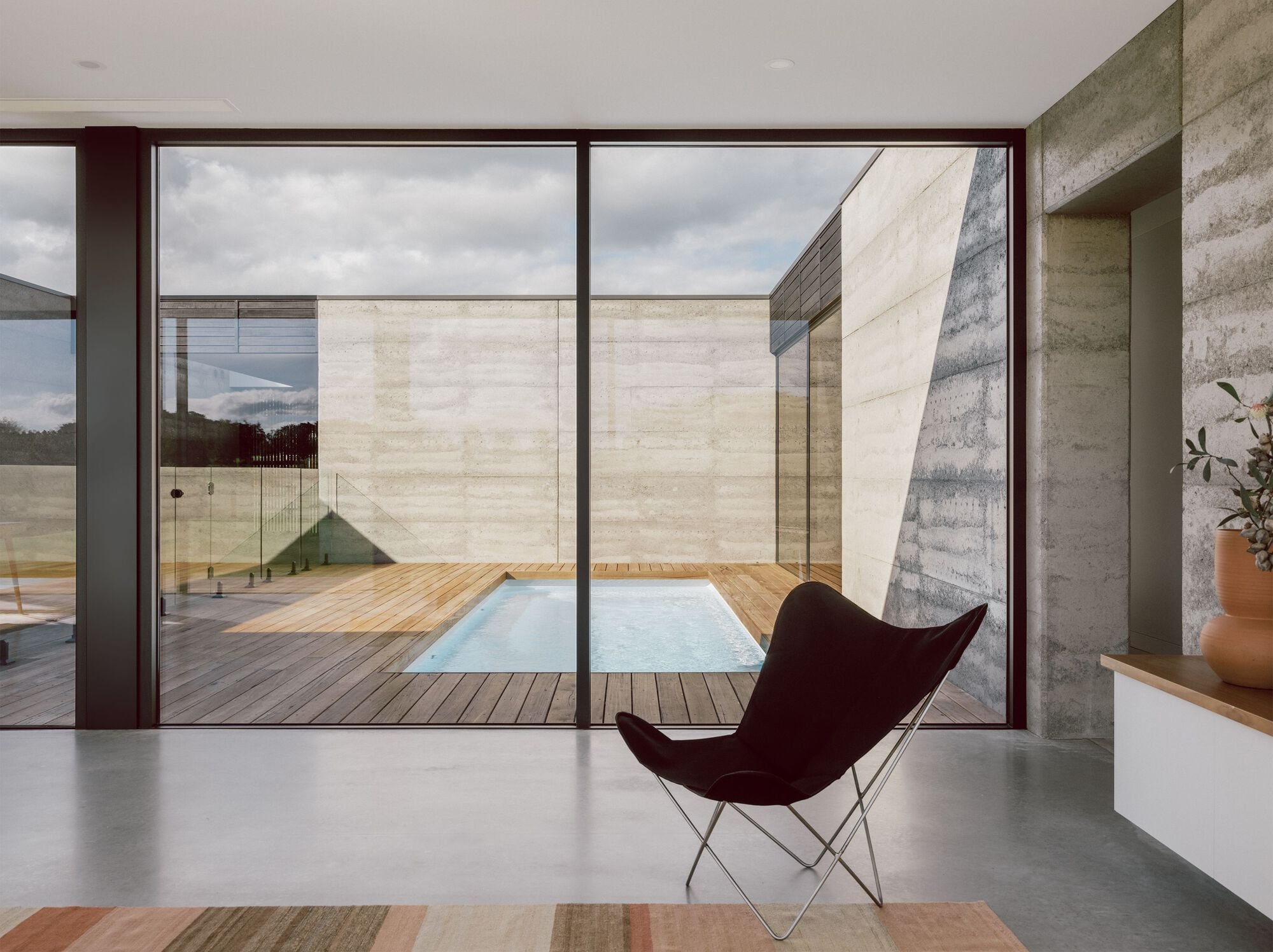 MGAO Wraps a Rammed Earth Courtyard House Around a Private Pool in Coastal Victoria