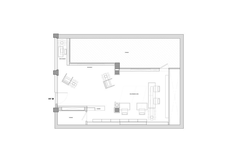 Floor plan drawing showing an angular open workspace with scattered furniture and perimeter service areas