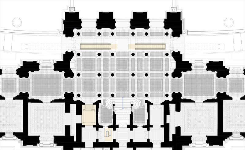 Floor plan drawing showing solid masses in black surrounding a grid of rooms and central entrance sequence