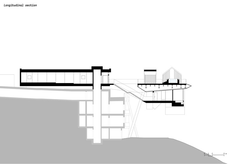 Longitudinal section drawing revealing interior spaces stepping down the hillside with connecting bridge