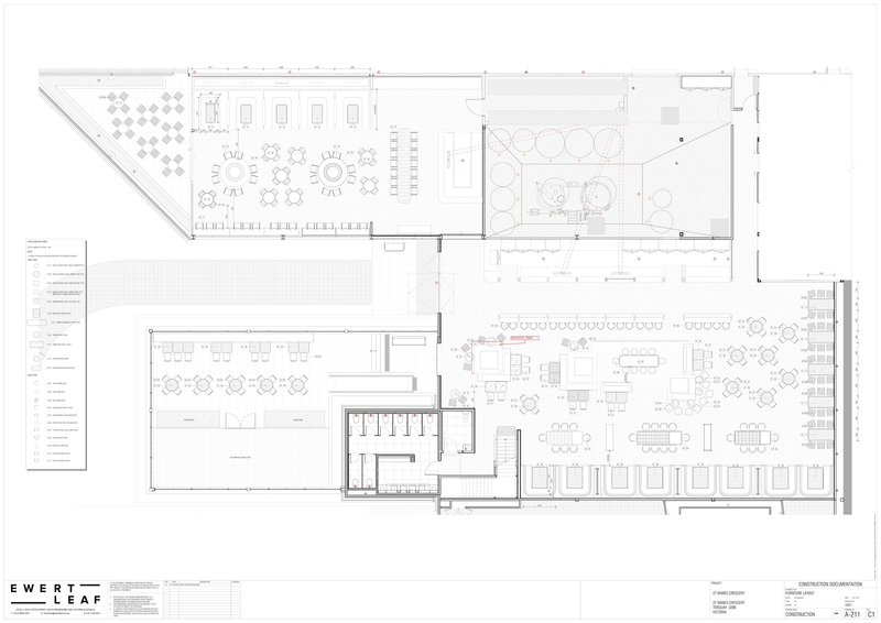 Floor plan drawing showing dining areas, kitchen, and outdoor terrace with circular seating arrangements