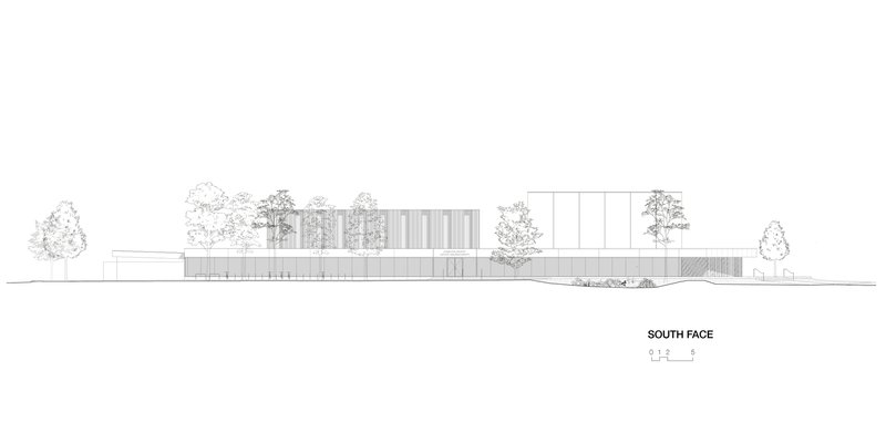 South elevation drawing showing the horizontal massing with vertical panel facades and surrounding trees